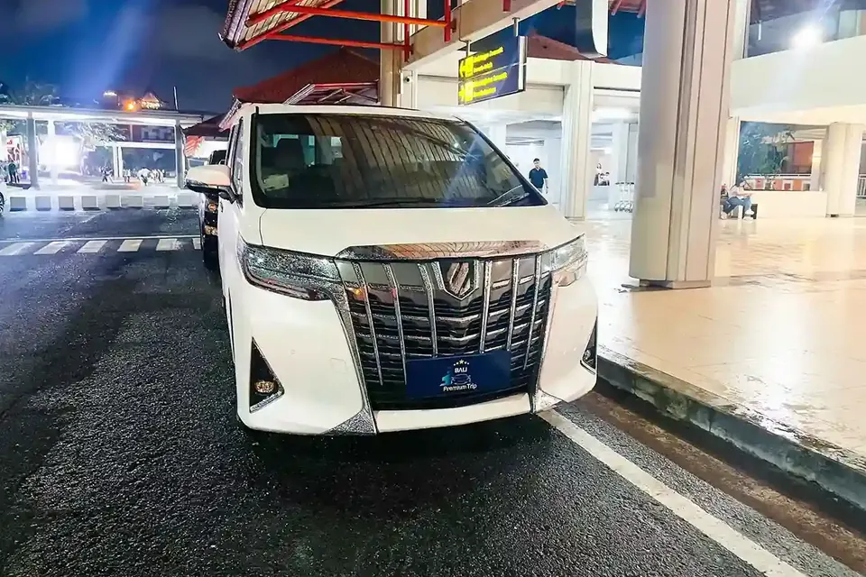 Toyota Alphard waiting at the Ngurah Rai arrivals kerb