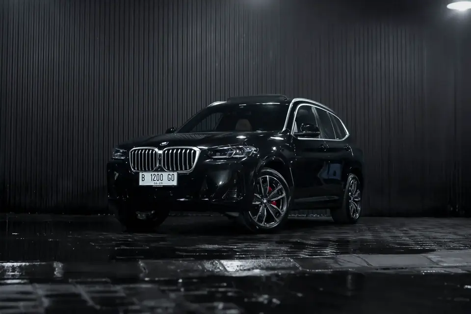 Black BMW X3 SUV in a studio