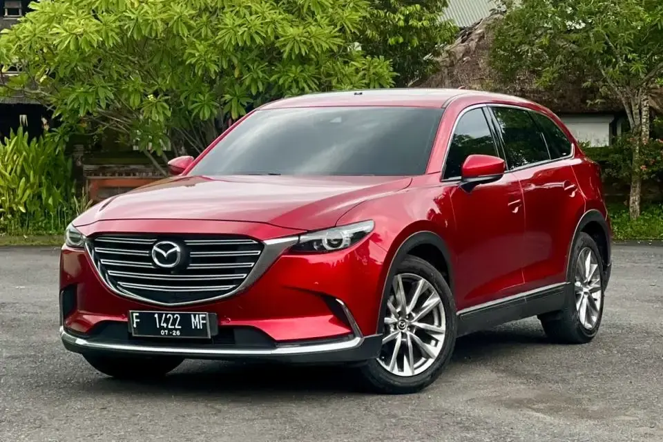 Red Mazda CX-9 SUV parked in Bali