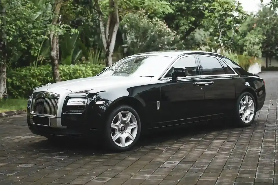 Black Rolls Royce Ghost on a driveway in Bali