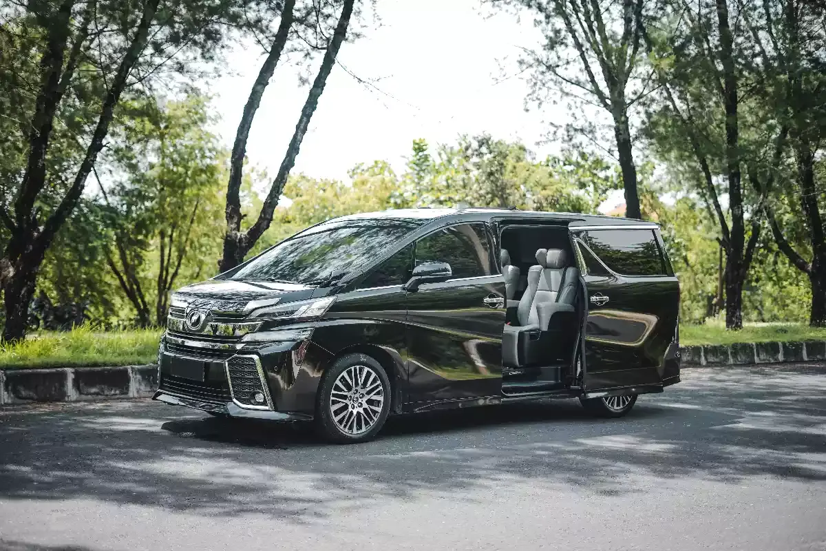 Toyota Vellfire with the sliding door open, showing grey captain seats